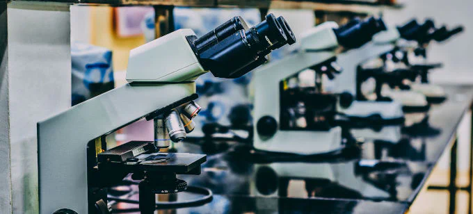 picture of multiple microscopes in a row